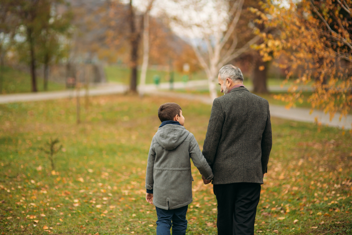 Grandpa and His Grandson Spend Time Together in the Park